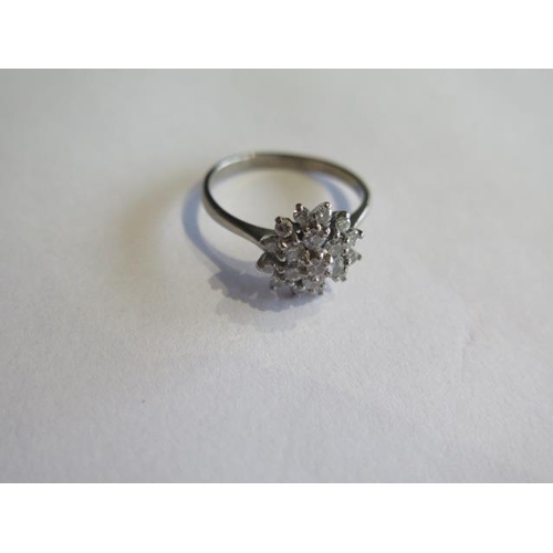 706 - An 18ct white gold diamond cluster ring, size Q, head approx 10mm, approx 3.9 grams, diamonds bright... 