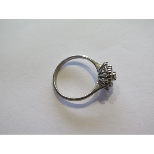 706 - An 18ct white gold diamond cluster ring, size Q, head approx 10mm, approx 3.9 grams, diamonds bright... 