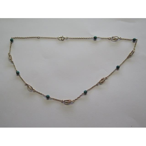 708 - A hallmarked 9ct yellow gold and green stone necklace, 43cm long, approx 5.3 grams, clasp working, i... 