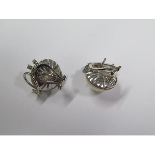 711 - A pair of 18ct white gold diamond and pearl earrings, 22mm wide, approx 15.8 grams, in good conditio... 