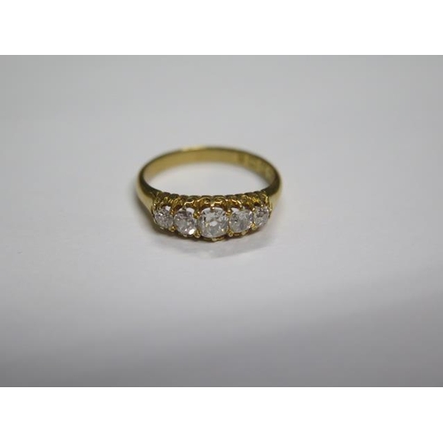 715 - A hallmarked 18ct yellow gold diamond 5 stone ring, size O/P, the central diamond approx 0.23ct, goo... 