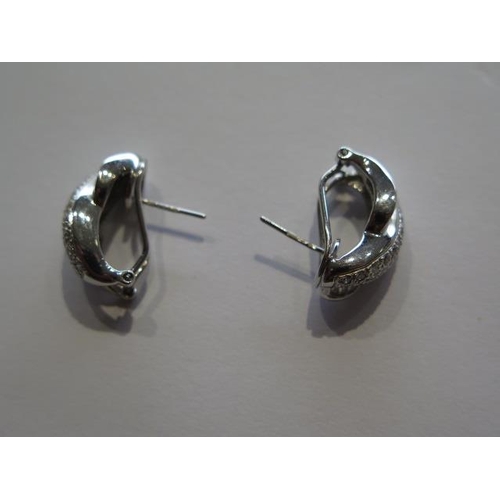 718 - A pair of 18ct white gold diamond earrings marked 18K 750, 2cm in length, approx 8 grams, in good co... 