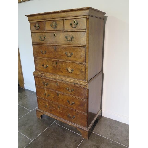 72 - A George 1st walnut chest on chest with three small drawers, over a  brushing slide and three furthe... 