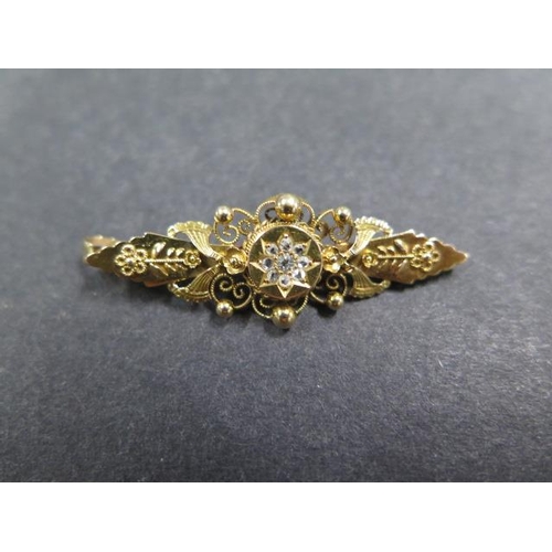 721 - A 15ct gold and diamond pendant, possibly a brooch conversion, 4.5cm long, approx 3.8 grams, in good... 