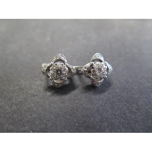 723 - A pair of 14ct white gold diamond cluster earrings, 10mm x 10mm, approx 5.6 grams, in good condition... 