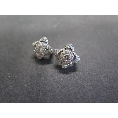 723 - A pair of 14ct white gold diamond cluster earrings, 10mm x 10mm, approx 5.6 grams, in good condition... 