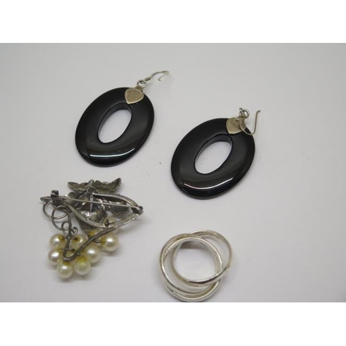 733 - A pair of silver and black onyx drop earrings, a silver Russian style ring and a silver and pearl br... 