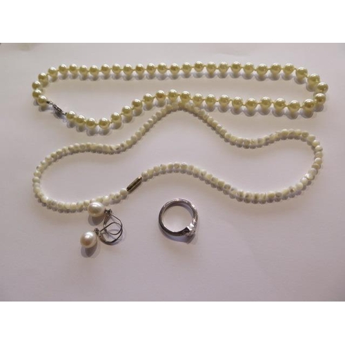 736 - A silver ring, size O, two necklaces and a pair of earrings (7172J)