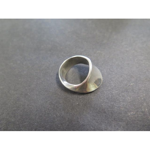 743 - A Georg Jensen sterling silver ring designed by Vivianna Torun Bulow Hube, no 148, size N, in genera... 