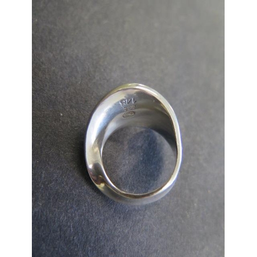 743 - A Georg Jensen sterling silver ring designed by Vivianna Torun Bulow Hube, no 148, size N, in genera... 