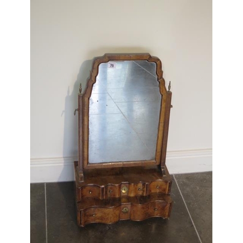 75 - A George 1st walnut toilet mirror with a serpentine four drawer front on replacepment feet, 67cm tal... 