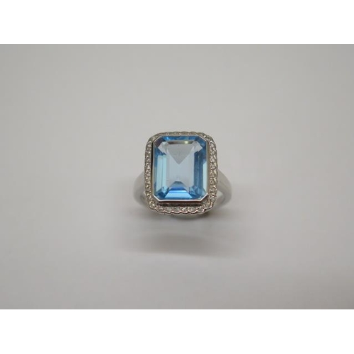 753 - A 9ct hallmarked white gold Art Deco style blue topaz and diamond ring, size M, head approx 16mm x 1... 