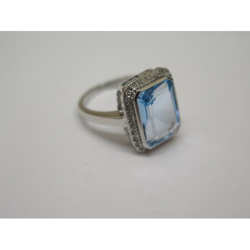 753 - A 9ct hallmarked white gold Art Deco style blue topaz and diamond ring, size M, head approx 16mm x 1... 