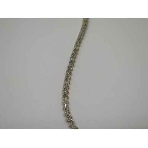 754 - A sterling gilt diamond tennis bracelet, 19cm long, in good condition