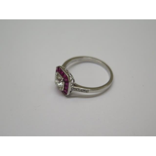 757 - A quality platinum Art Deco style ruby and diamond ring, with diamond shoulders, centre diamond appr... 