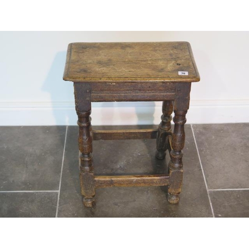 76 - An 18th century oak joint stool, 57cm tall x 45cm x 27cm, with wear consistent with age and later re... 