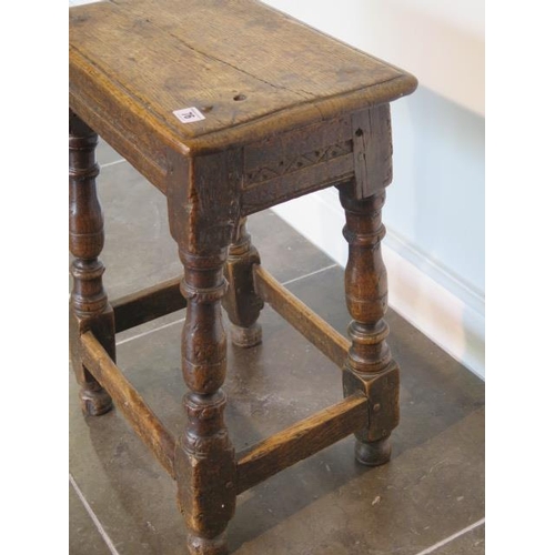 76 - An 18th century oak joint stool, 57cm tall x 45cm x 27cm, with wear consistent with age and later re... 