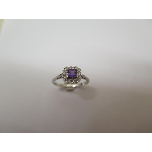 766 - A 14ct white gold amethyst and diamond ring, hallmarked, size N/O, head approx 9mm x 8mm, in good co... 