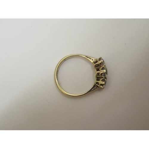 771 - A 9ct hallmarked three stone (synthetic) ring, size O, approx 2.4 grams, in good condition