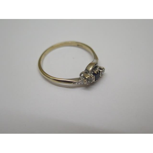 773 - A 9ct three stone (synthetic) cross over ring, size S, approx 2.1 grams, in good condition