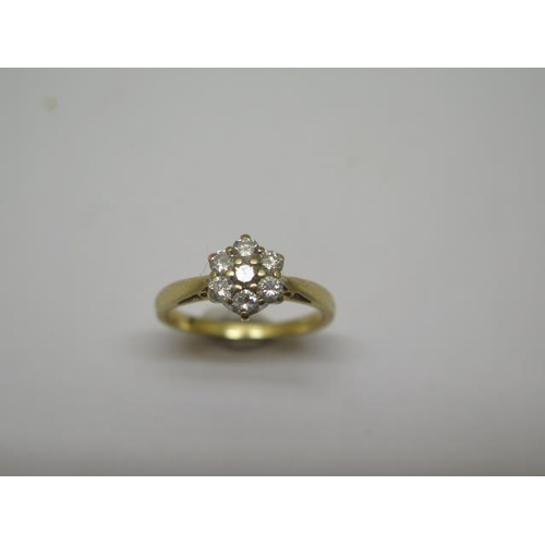 775 - A hallmarked 18ct yellow gold seven stone diamond cluster ring, 0.50ct in total, ring size N, approx... 