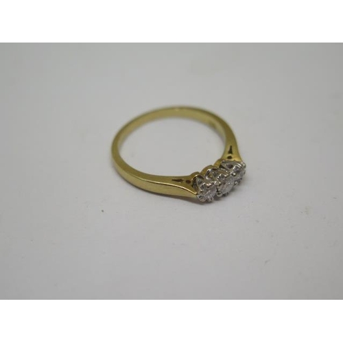 777 - A hallmarked 18ct yellow gold three stone diamond ring, 0.25ct, ring size L/M, in good condition and... 