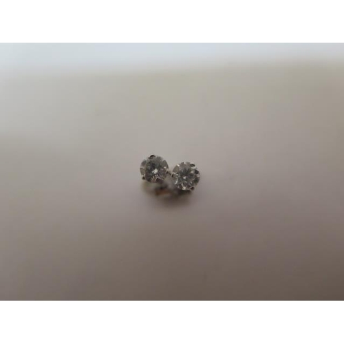 779 - A pair of 14ct white gold diamond stud earrings, approx 0.16ct each, white gold backs, in good condi... 