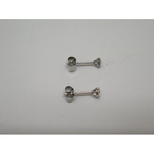 779 - A pair of 14ct white gold diamond stud earrings, approx 0.16ct each, white gold backs, in good condi... 