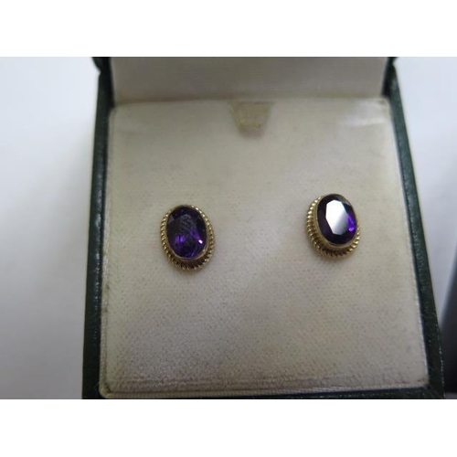 785 - Two hallmarked 9ct gold amethyst rings, size P and G, and a pair of 9ct gold amethyst earrings, mark... 