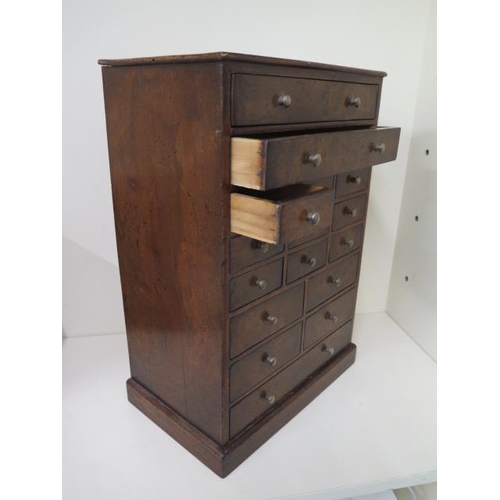 79 - A walnut veneered sixteen drawer jewellery / trinket collectors chest, 47cm tall x 32cm x 20cm