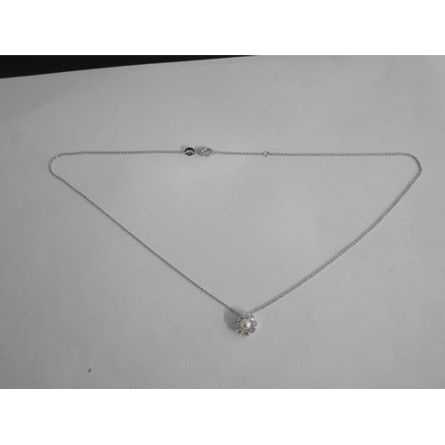 796 - A 18ct white gold diamond and pearl pendant on an 18ct hallmarked gold chain, 40cm long, total diamo... 