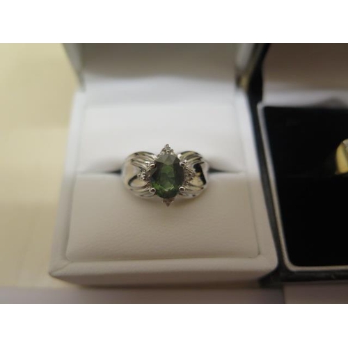 803 - Two GTV gold rings, a white gold green sapphire and diamond ring, size N approx weight 5.4 grams, an... 