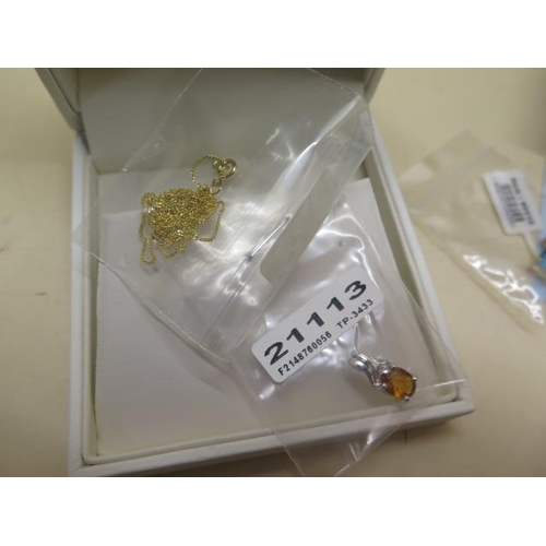 813 - Four GTV 9ct gold pendants, 2 with fine gold chains, 2 with certificates and all still sealed