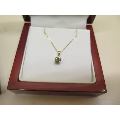 815 - A 9ct white gold GTV rubellite pendant and fine chain and an 18ct yellow gold green tormaline diamon... 