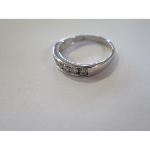 818 - A hallmarked 18ct white gold seven stone diamond ring 0.50ct, ring size L, approx 3.3 grams, diamond... 