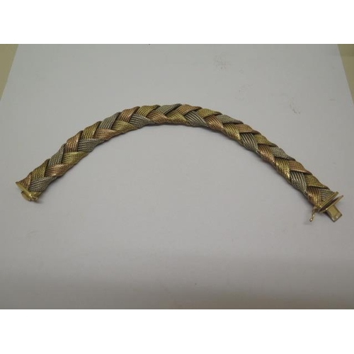 827 - An 18ct trigold woven bracelet, 20cm long, approx 37 grams, marked 750, generally good with minor th... 