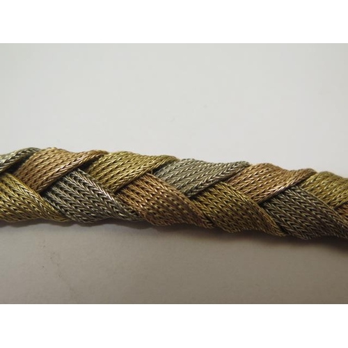 827 - An 18ct trigold woven bracelet, 20cm long, approx 37 grams, marked 750, generally good with minor th... 