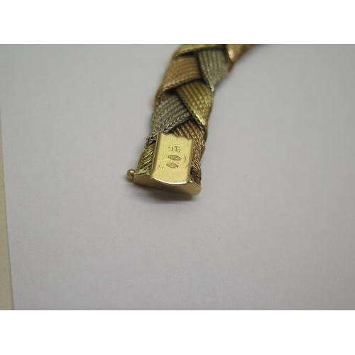 827 - An 18ct trigold woven bracelet, 20cm long, approx 37 grams, marked 750, generally good with minor th... 