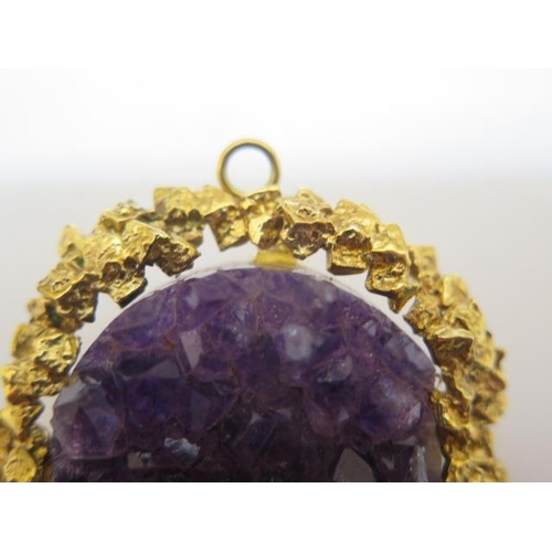 828 - A hallmarked 9ct yellow gold cabouchon amethyst Harris and Maisey ring and earring set, with a simil... 