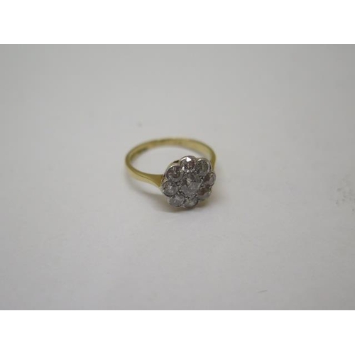 843 - An 18ct gold 9 stone diamond cluster ring, size K/L, approx 2.6 grams, head approx 10mm, diamonds br... 