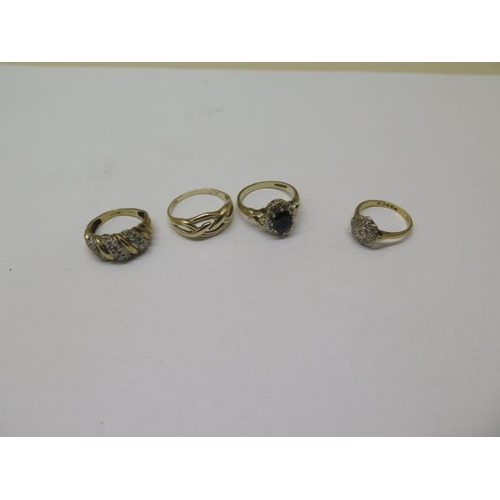 849 - An 18ct gold ring, approx 2.6 grams, size K, and three 9ct dress rings, approx 8.4 grams