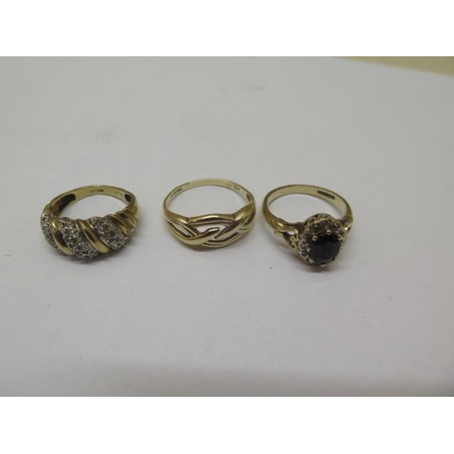 849 - An 18ct gold ring, approx 2.6 grams, size K, and three 9ct dress rings, approx 8.4 grams