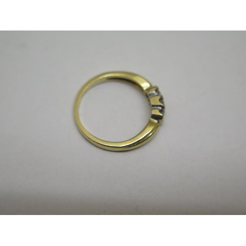 852 - A hallmarked 18ct yellow gold three stone diamond ring, size K, approx 3 grams, some wear but genera... 