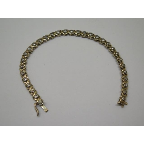 857 - A 9ct yellow gold diamond bracelet, approx total 1ct diamonds, 19cm long, approx 13.5 grams