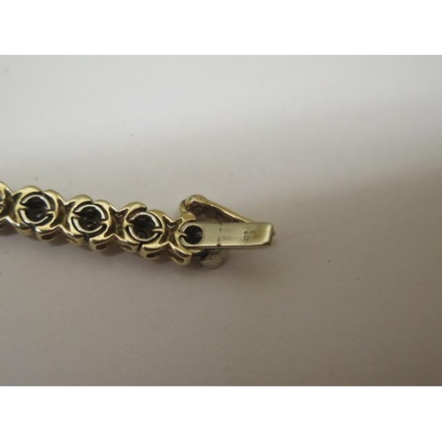 857 - A 9ct yellow gold diamond bracelet, approx total 1ct diamonds, 19cm long, approx 13.5 grams