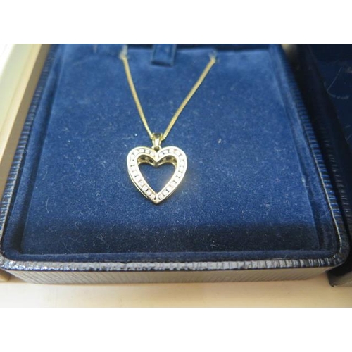 863 - A 9ct gold heart locket on chain and a 9ct heart pendant on chain, total weight approx 8.4 grams