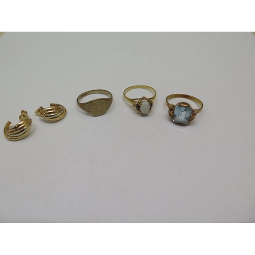 865 - Three 9ct yellow gold rings, sizes N/O/Q, and a pair of 9ct earrings, total weight approx 9.2 grams