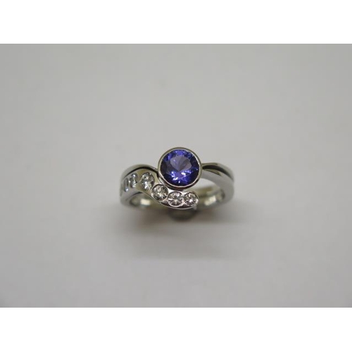 867 - A good quality platinum diamond and tanzanite ring, size O, approx 11 grams, diamonds approx 0.45ct,... 