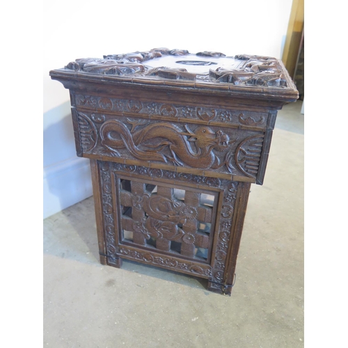 87 - A 19th century Chinese hardwood work box with hinged lid and all over carved dragon detail over a si... 