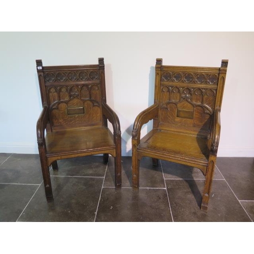 91 - A near pair of Gothic type open throne chairs, 114cm tall x 67cm x 52cm deep, both in good sturdy co... 